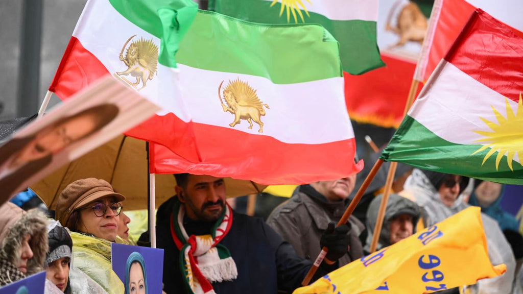 Historical Iranian imperial flag flying on a pole