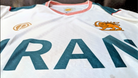 Close-up of Lion and Sun crest on Iran national football jersey