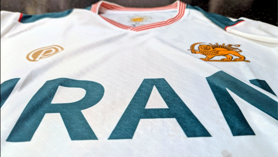 Close-up of Lion and Sun crest on Iran national football jersey