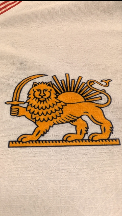 Close-up of Lion and Sun crest on Iran national football jersey