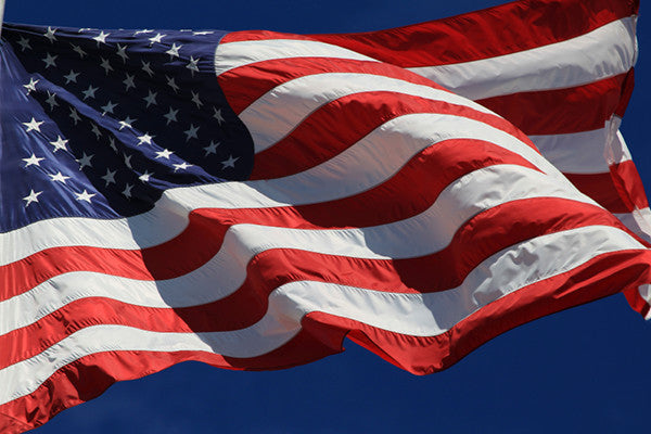 3x5 American Flag flying on a pole outdoors